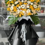 Yellow and White Funeral Flower Stand